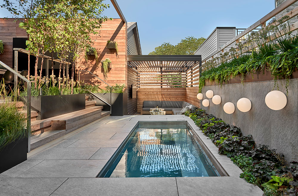 Stainless steel pool  with  bench seating, automatic cover, LED lighting and interior descending stairway.  76”X194”x51”