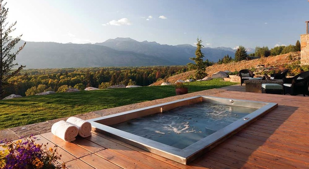 Custom Stainless Steel Spa with Two Loungers, Interior Stairway, Cool Down Area, Bench Seating, and LED lighting. 120” x 66” x 36”