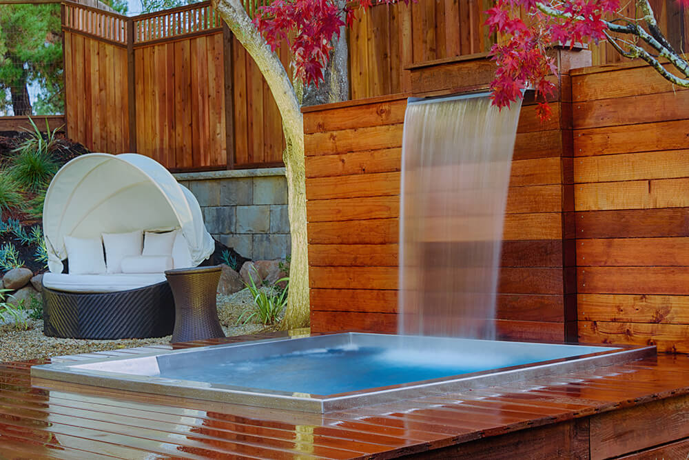 Stainless Steel Water Spout Feature with Custom Steel Spa with Bench Seating, Lounger, and LED lighting. 94