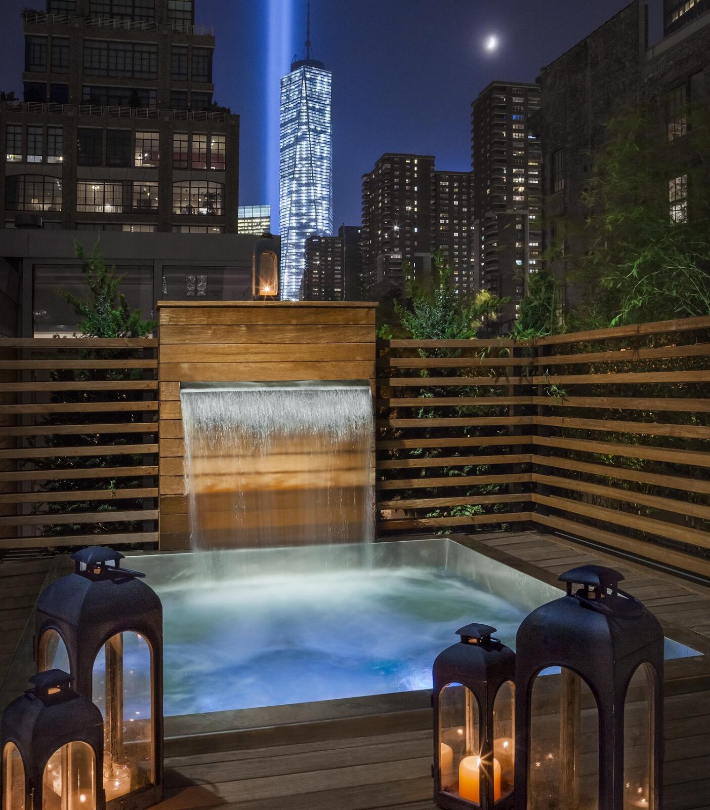 Custom Stainless Steel Spa with Bench Seating. 81” x 87” x 42”  Custom stainless steel water feature 40”x67” with a 36” water spout.