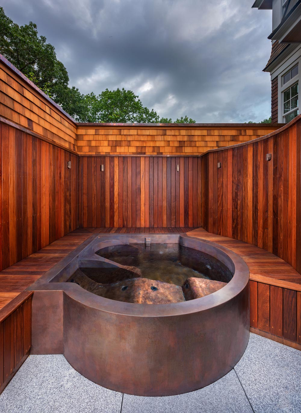 Copper spa with lounger, foot jets, cool down area, captain’s chair, LED lighting and custom front skirting.