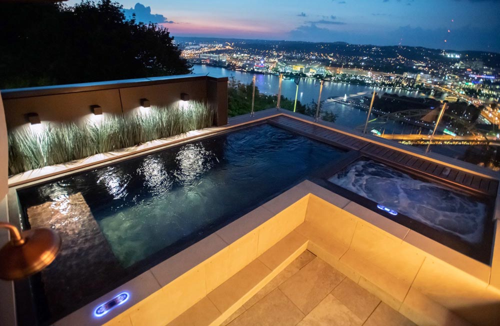 Copper rooftop pool with swim jet system, bench seating, LED lighting and neighboring copper spa. Pool 106
