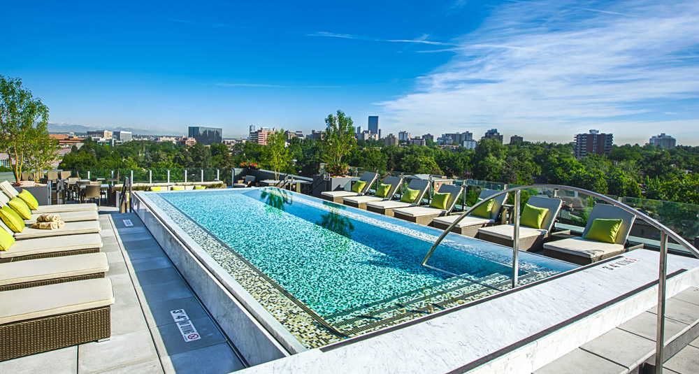 My Block Wash Park, Denver, CO.  Tiled stainless steel swimming pool with descending stairs, autocover, LED lighitng and water feature with front catch basin. 426