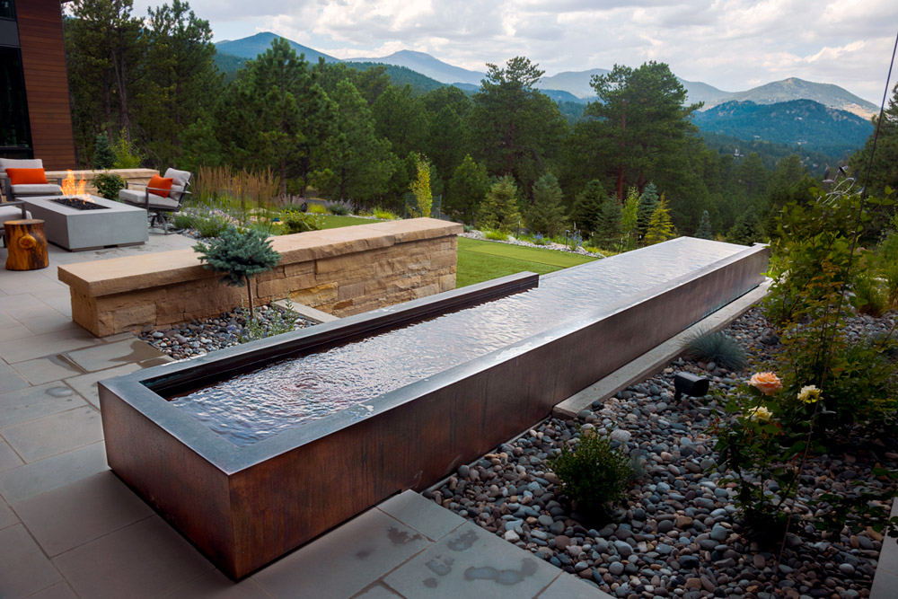 Copper water feature with two sided vanishing edge, falling water wall and trough system   54”x 280”x 72”