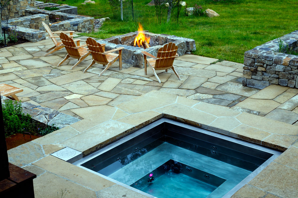 Stainless steel spa with bench seating and LED lighting. 84”x95”x42”