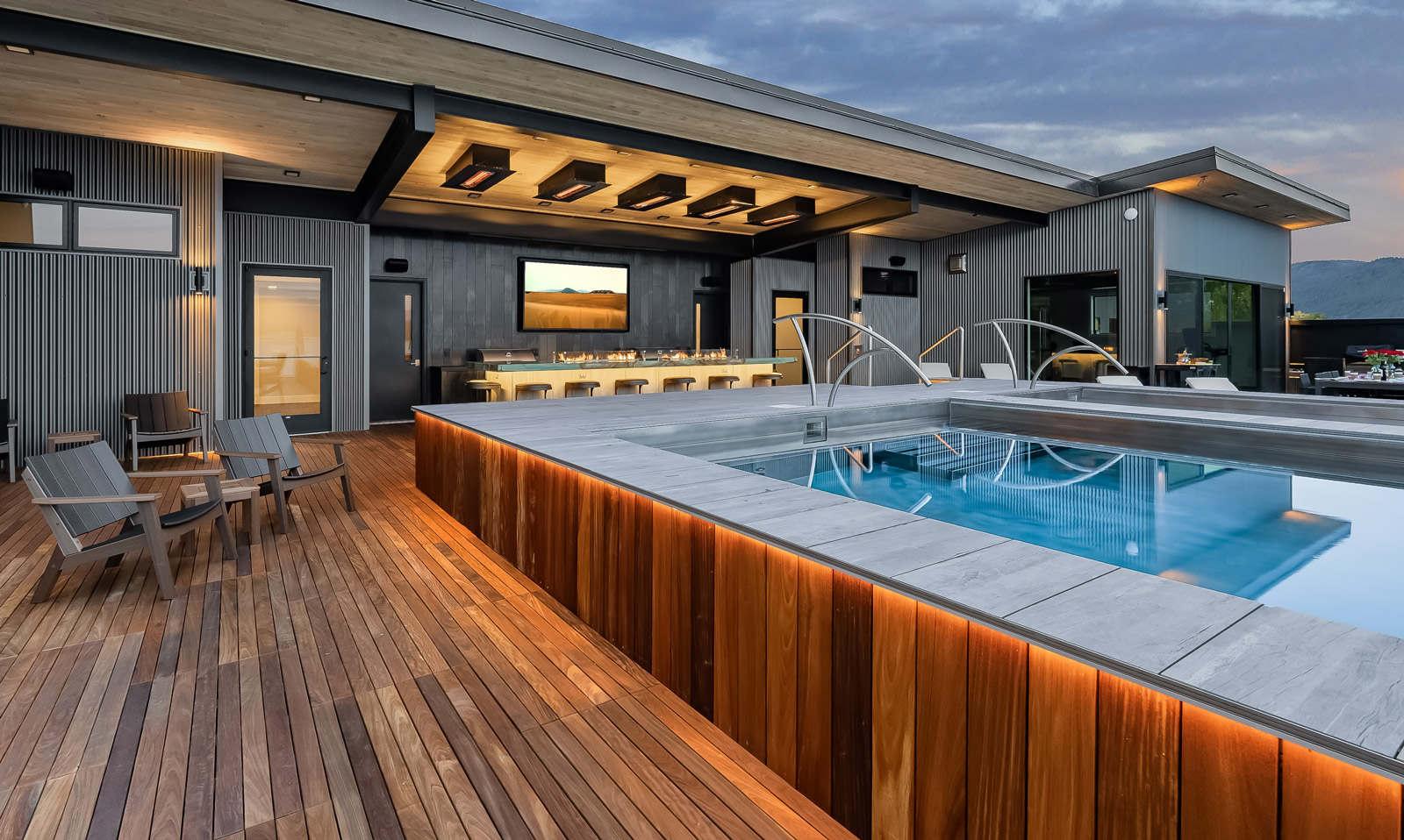 Rooftop stainless steel pool and spa with automatic cover and LED lighting.  Both pool and spa have interior descending stairways and bench seating.  179”x330”x48”